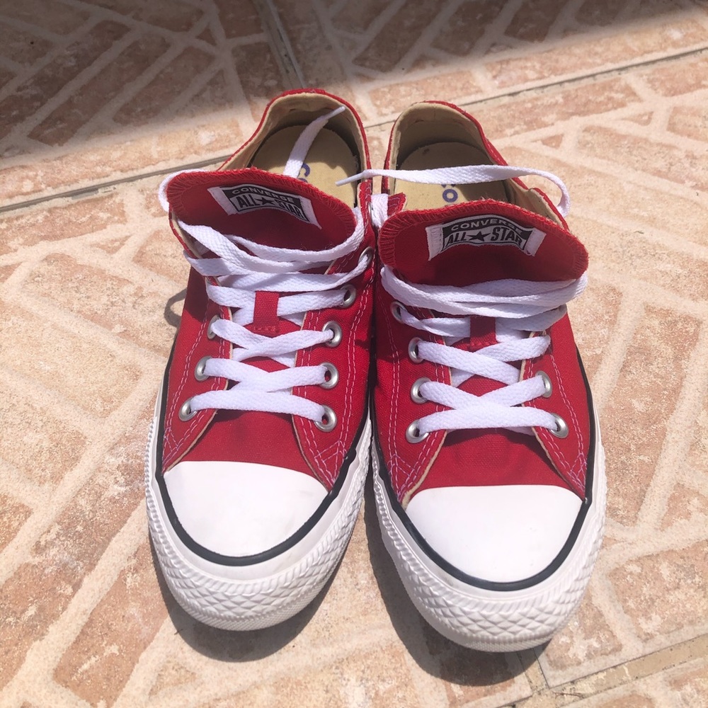 Red Converse All Star sneakers.